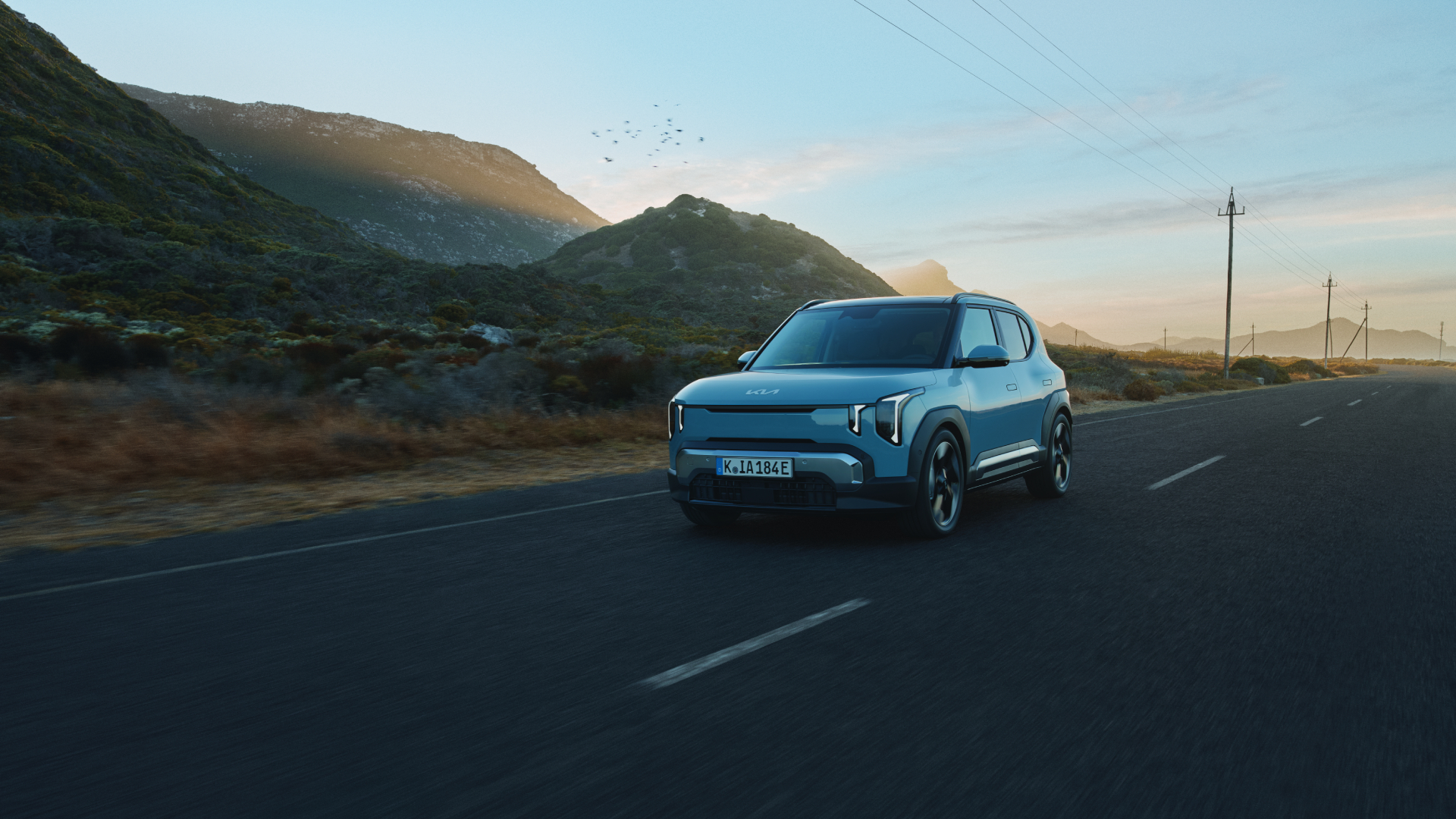 EV2_BL_MY27_LHD_Print_KeyVisual_Driving Motif_CMYK